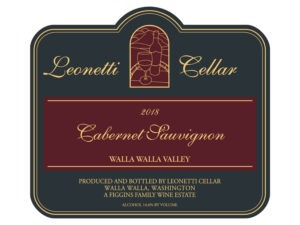 Leonetti Cabernet Sauvignon 2018; A black rectangular label with a gold border. A central maroon stripe with gold text. A small gold bordered maroon 'stained window' above with a gold line drawing od bottle and glass with gold text to each side and below the central bar.