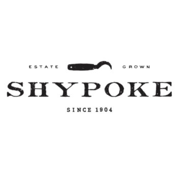 Elegant white rectangular label with black text across the middle and showing an image of a gardener's harvesting sickle