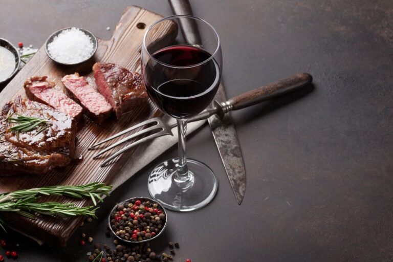 best wine with steak a juicy seasoned steak with a deep rich glass of red wine